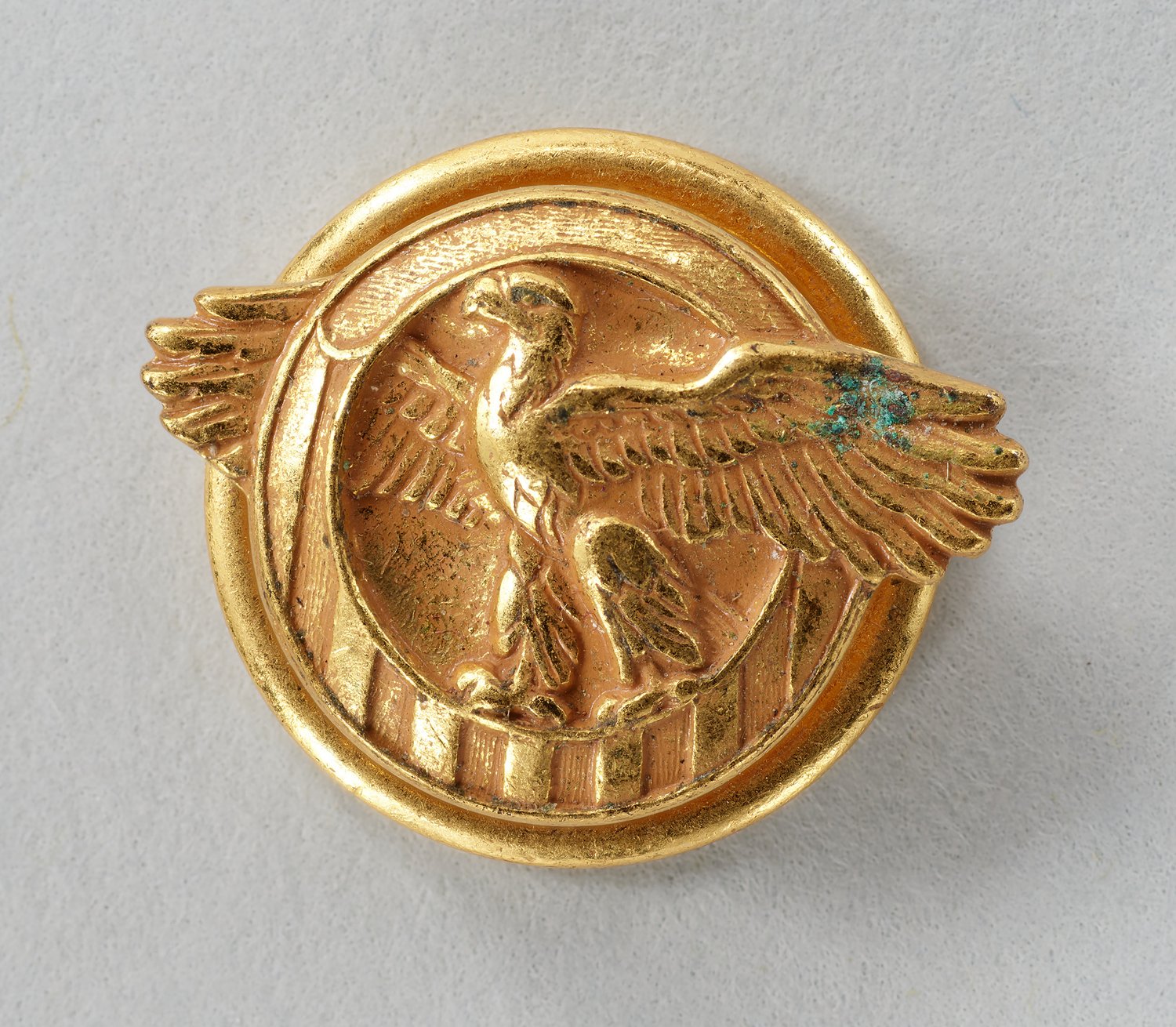 Lapel pin for Honorable Discharge issued to Lt. Louise Lomax, Army Nurse Corps